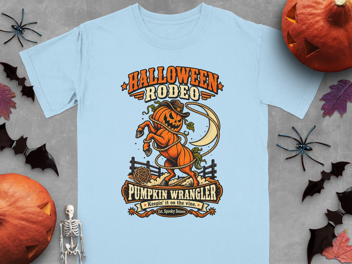 Light blue t-shirt with Halloween Rodeo graphic of a pumpkin wrangler.