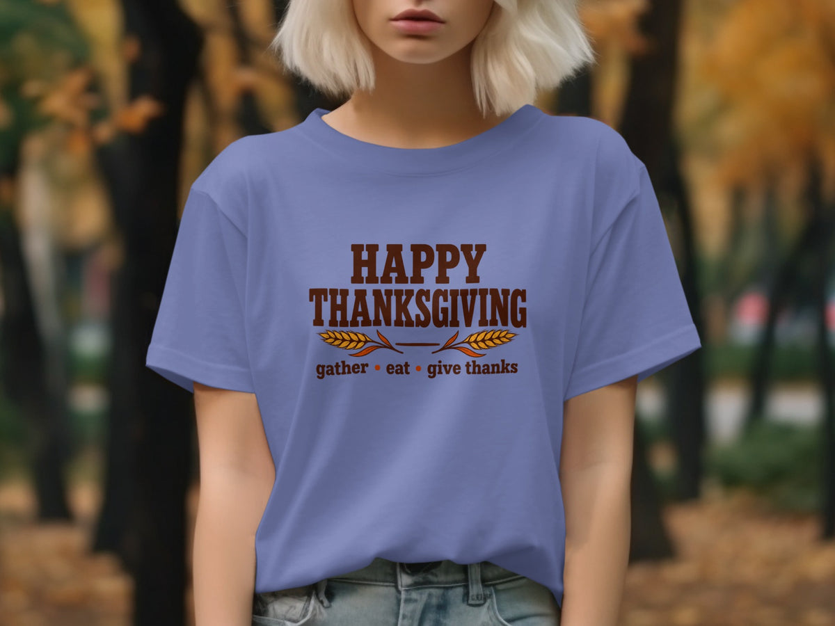 Purple t-shirt with "Happy Thanksgiving gather eat give thanks" text.