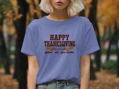 Purple t-shirt with "Happy Thanksgiving gather eat give thanks" text.