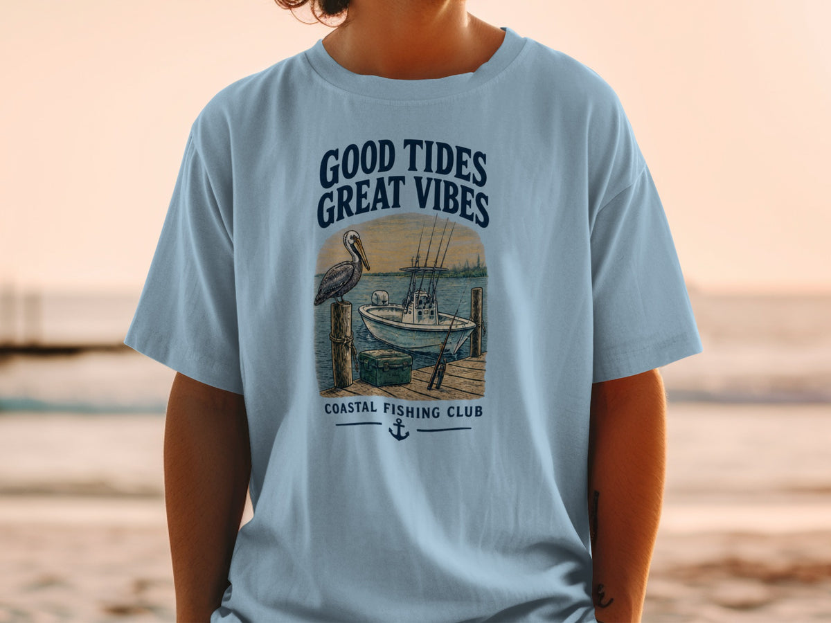 T-shirt with "Good Tides Great Vibes" and a pelican, boat, and fishing gear.