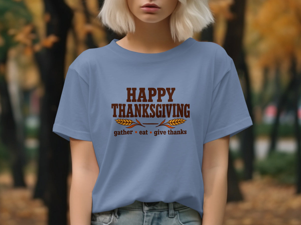 Blue t-shirt with "Happy Thanksgiving" and "gather eat give thanks" text.