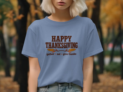 Blue t-shirt with "Happy Thanksgiving" and "gather eat give thanks" text.