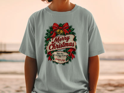Light gray t-shirt with "Merry Christmas" and "Simple joys" text in a festive wreath.
