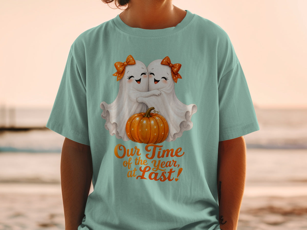 Two watercolor ghosts hug a pumpkin with text "Our Time of the Year, at Last!"