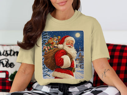 Santa Claus carrying a sack of gifts through a snowy village at night.