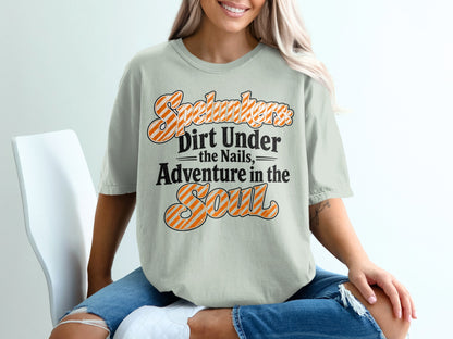 "Spelunkers: Dirt Under the Nails, Adventure in the Soul" graphic t-shirt.
