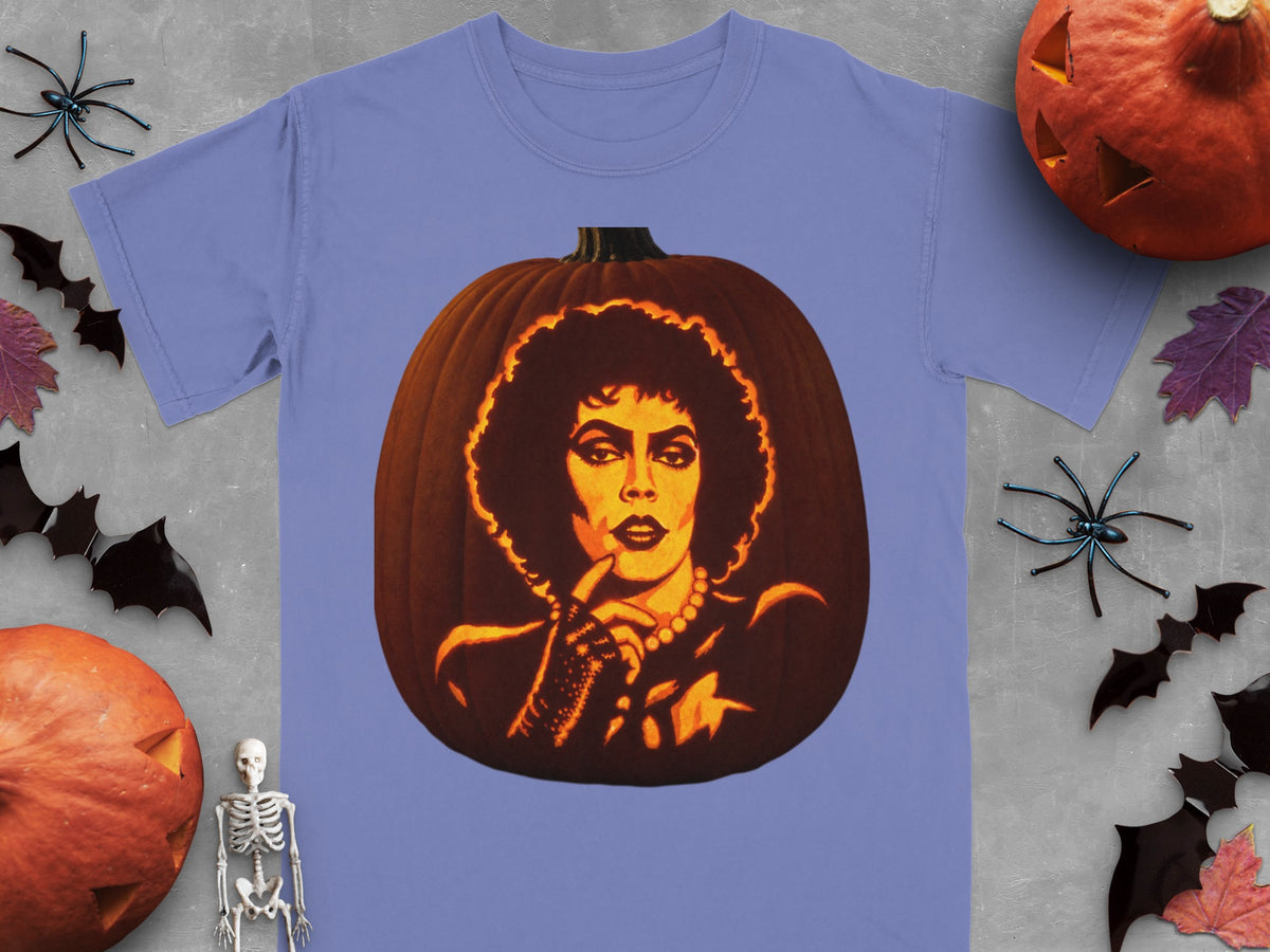 Periwinkle t-shirt featuring a lit jack-o'-lantern carved with the face of Dr. Frank-N-Furter from The Rocky Horror Picture Show.