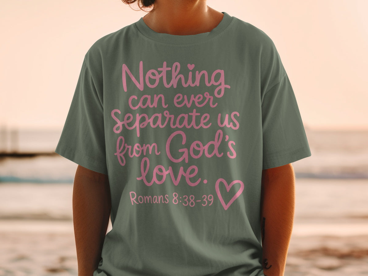 Olive green t-shirt with pink text "Nothing can ever Separate us from God's love. Romans 8:38-39".