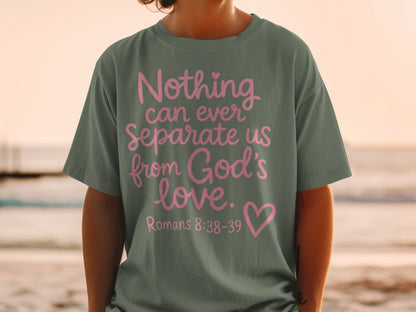 Olive green t-shirt with pink text "Nothing can ever Separate us from God's love. Romans 8:38-39".
