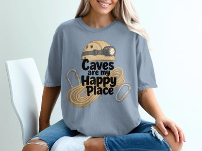 Gray t-shirt with graphic of helmet, rope, and carabiners, text "Caves are my Happy Place".