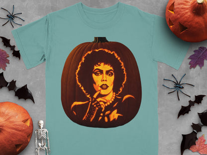 Teal t-shirt featuring a lit jack-o-lantern carved with the face of Frank-N-Furter from The Rocky Horror Picture Show.