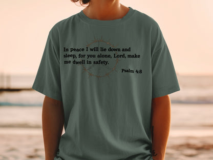 Green t-shirt with barbed wire peace sign and Psalm 4:8 scripture.