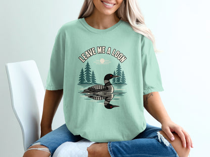 T-shirt with graphic of a loon and text "LEAVE ME A LOON".
