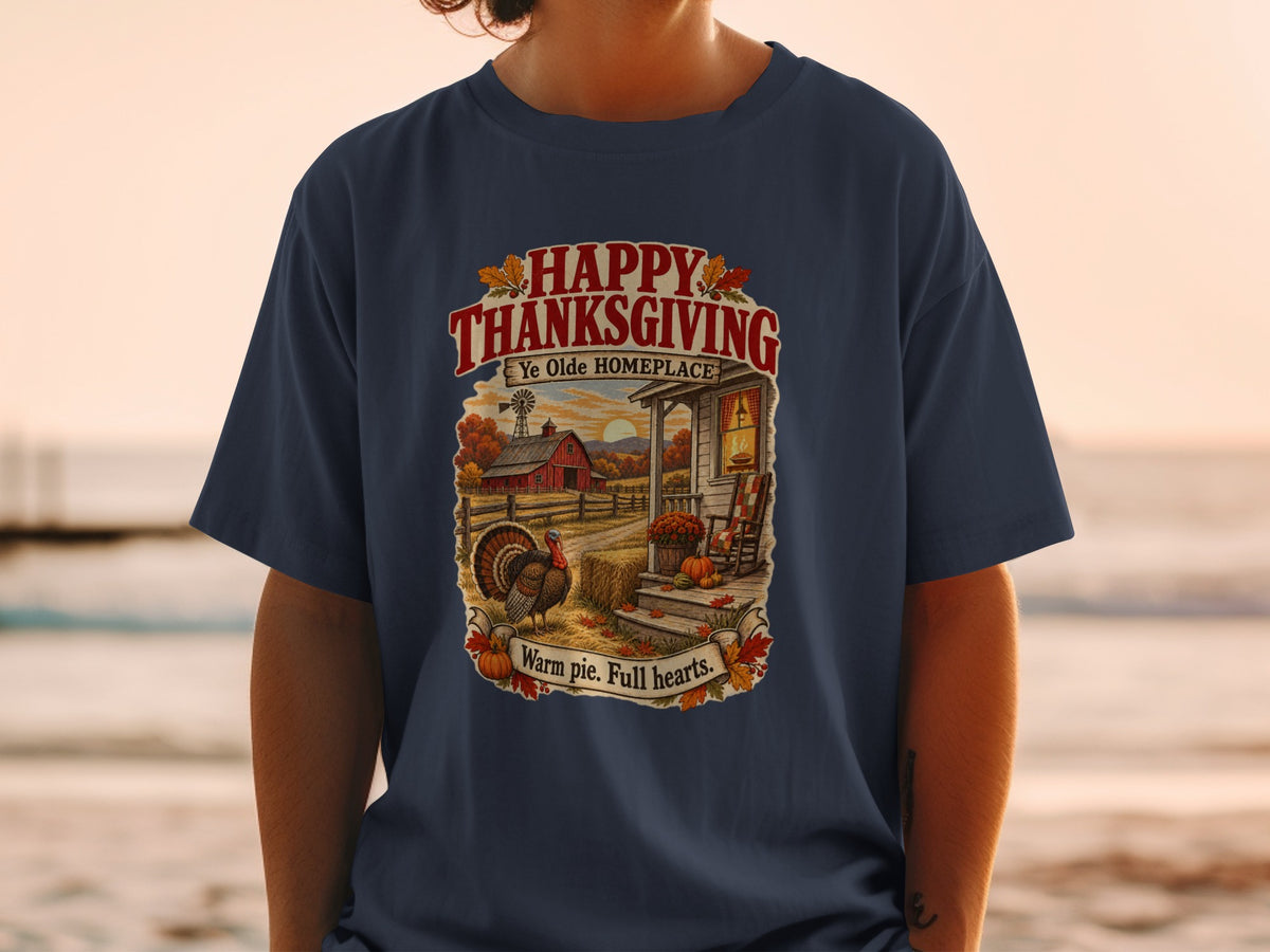 Thanksgiving t-shirt with farm scene, turkey, and text "Happy Thanksgiving Ye Olde Homeplace Warm pie. Full hearts."