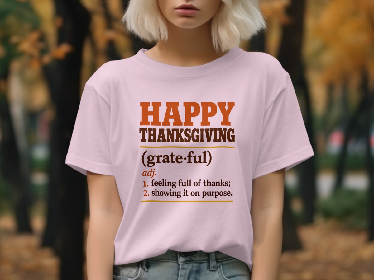 Light pink t-shirt with text defining "Happy Thanksgiving."