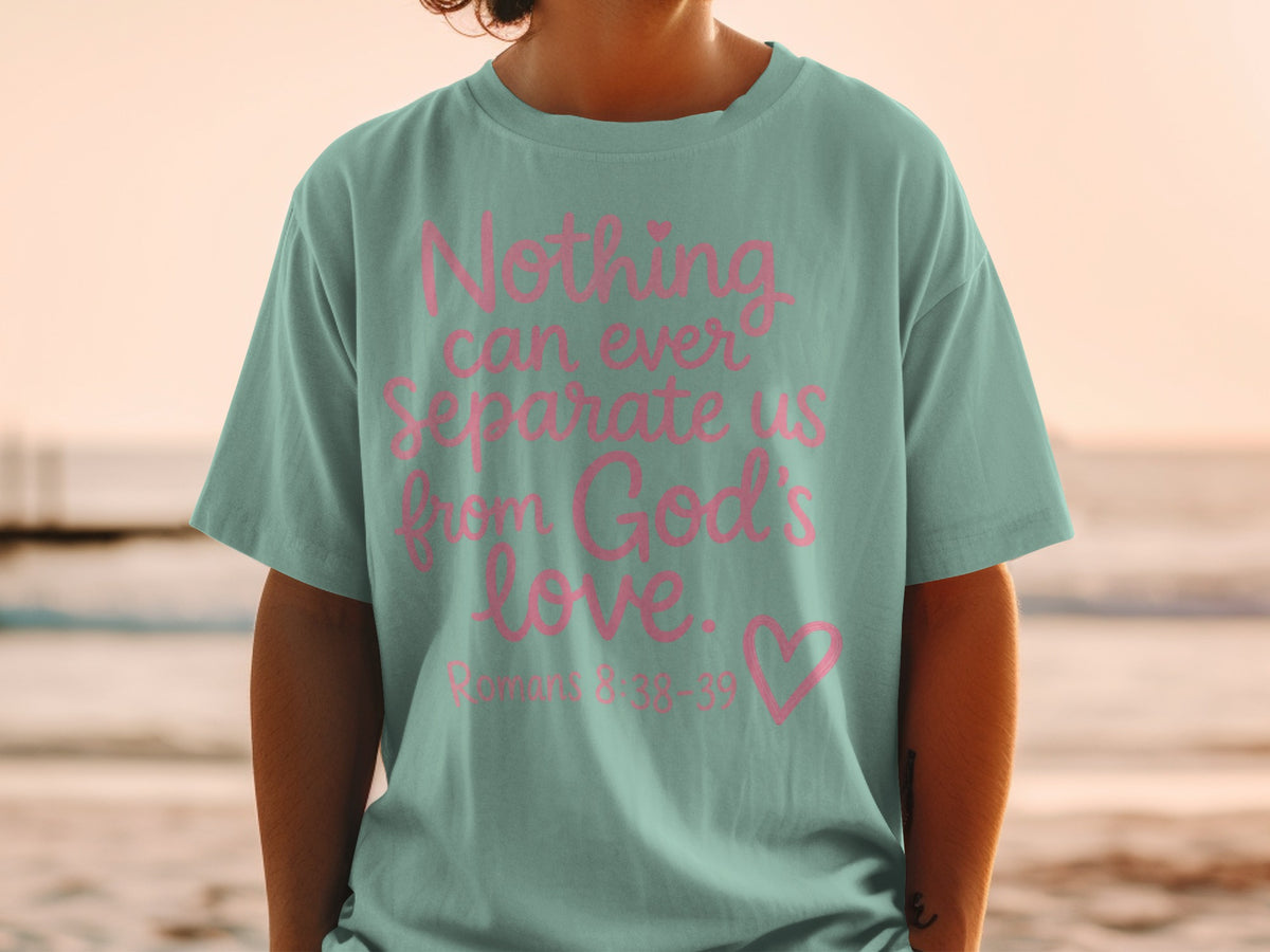 Teal t-shirt with pink text "Nothing can ever separate us from God's love. Romans 8:38-39"