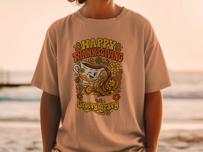 T-shirt with "Happy Thanksgiving Groovy Gravy" text and a smiling gravy boat graphic.