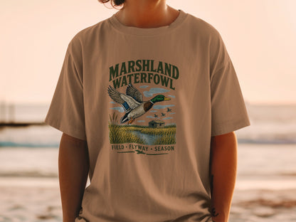 T-shirt with "MARSHLAND WATERFOWL FIELD FLYWAY SEASON" text and duck graphic.