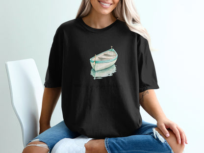 Black t-shirt with watercolor of a small boat and text: "Well, first you gotta get you a little boat."