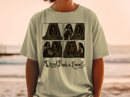 Four-panel comic strip on a t-shirt showing a dryad in a tree, with text "Dryad Finds a Friend!".