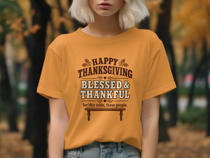 Orange t-shirt with "Happy Thanksgiving Blessed & Thankful for this table, these people." text.