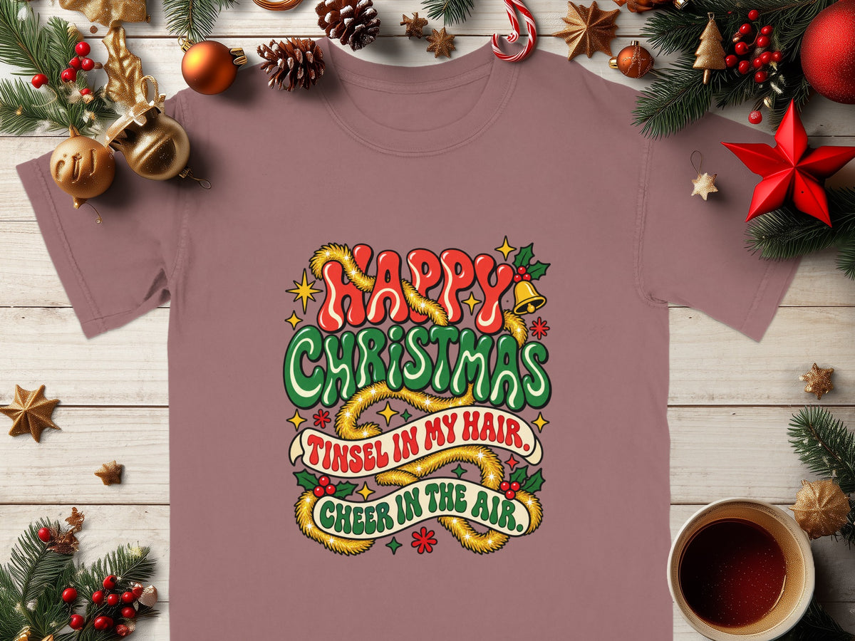 T-shirt with "Happy Christmas, Tinsel in My Hair, Cheer in the Air" text and festive decorations.
