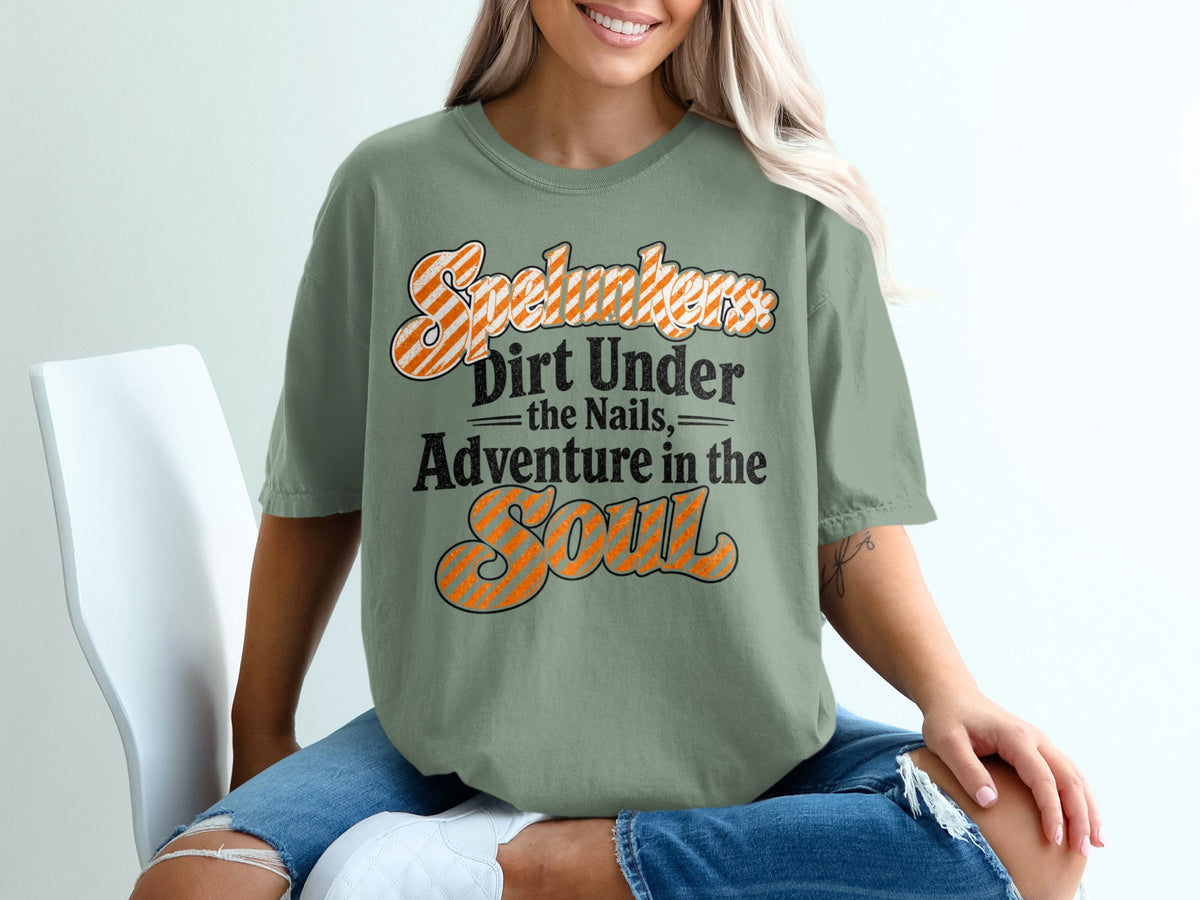 "Spelunkers: Dirt Under the Nails, Adventure in the Soul" graphic t-shirt.