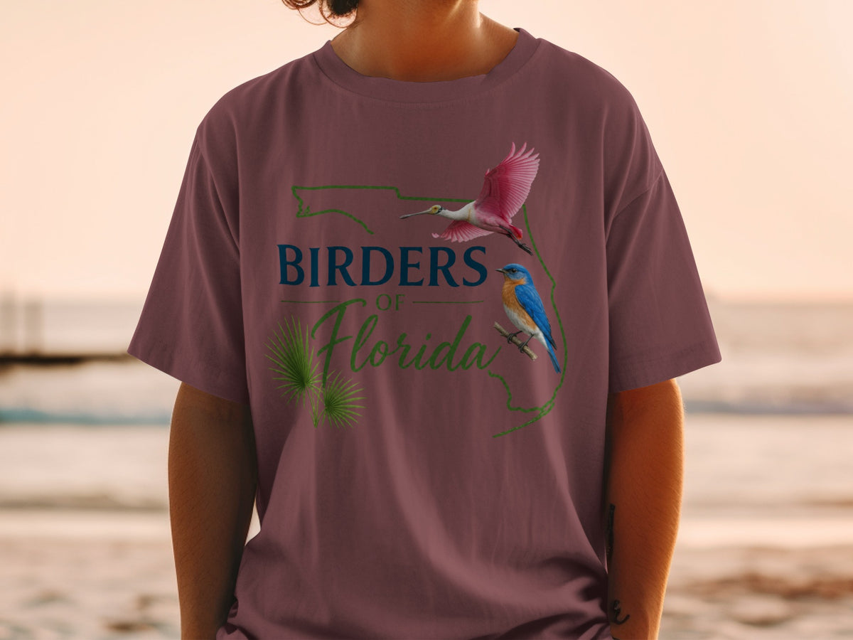 T-shirt with Florida outline, roseate spoonbill, bluebird, and text.