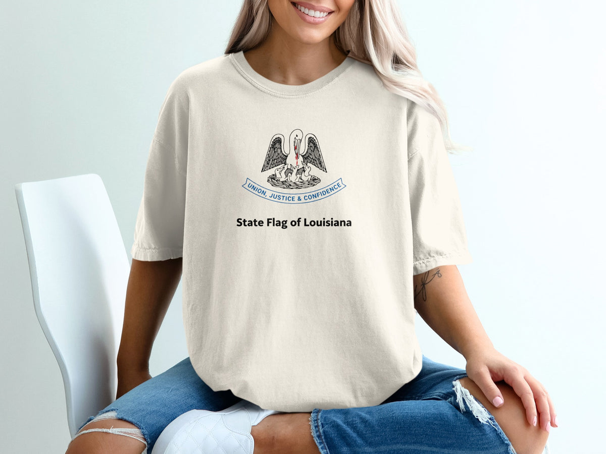 Cream t-shirt with Louisiana flag pelican design and text.