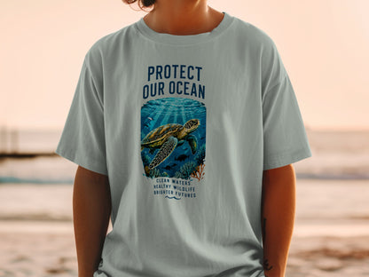 T-shirt with "Protect Our Ocean" text, sea turtle, and coral reef design.