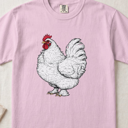 A light pink t-shirt featuring a detailed illustration of a fluffy white rooster with a red comb.