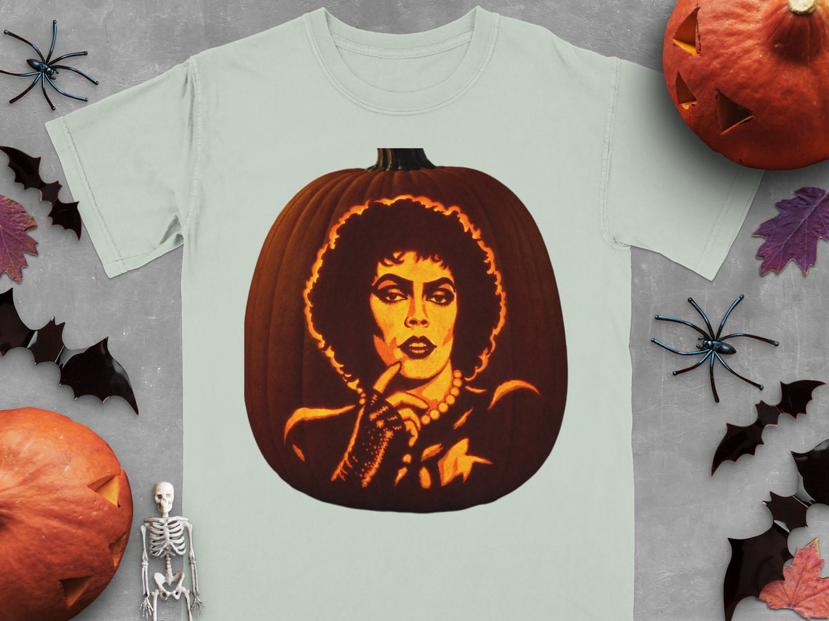 A light green t-shirt features a large graphic of a jack-o-lantern carved with Frank-N-Furter's face.