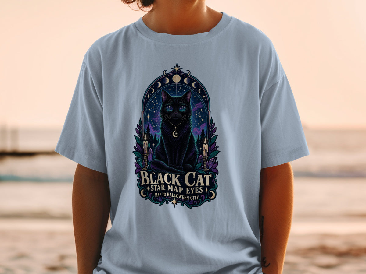 Black cat with starry eyes, candles, and moon phases on a t-shirt.