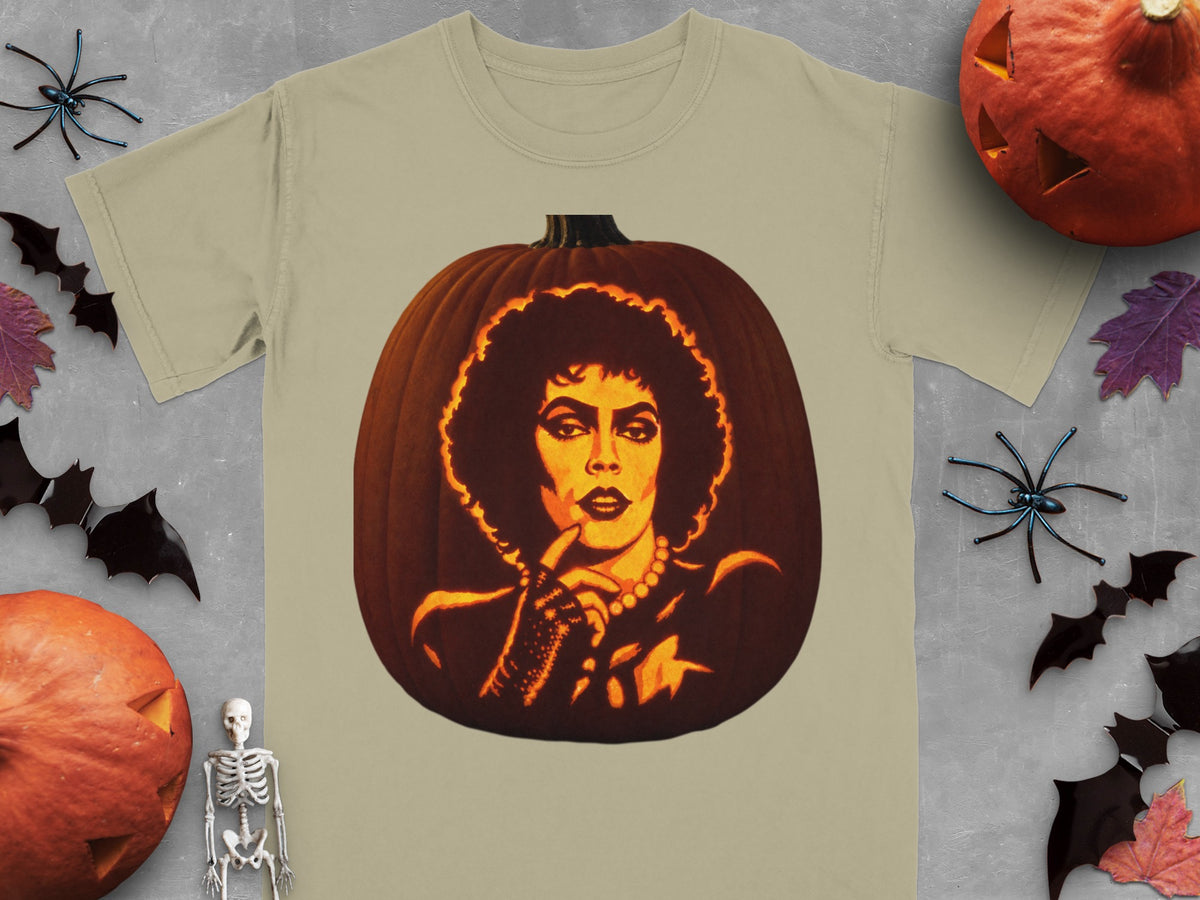 Khaki t-shirt featuring a large carved jack-o-lantern graphic of Frank-N-Furter surrounded by Halloween decorations.