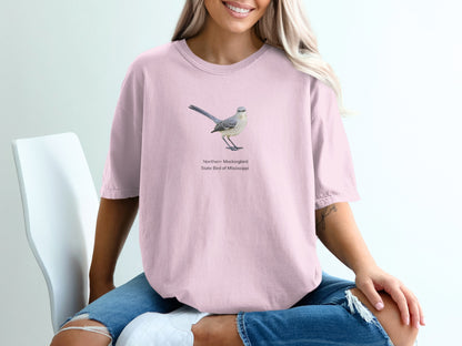 Pink t-shirt with illustration of a Northern Mockingbird, State Bird of Mississippi.