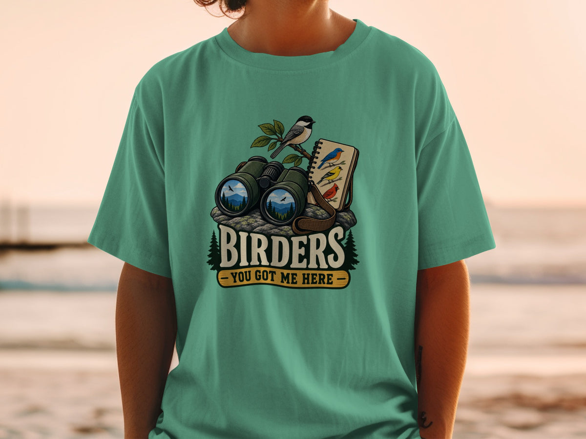 Binoculars, birds, and notebook illustration with text "BIRDERS - YOU GOT ME HERE".