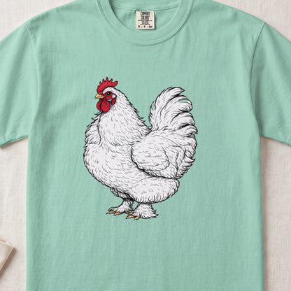 A mint green t-shirt featuring a detailed illustration of a fluffy white rooster with a red comb.