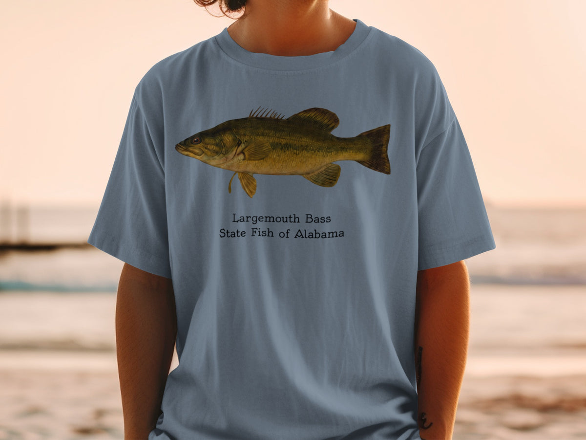 Largemouth Bass, State Fish of Alabama graphic on a blue t-shirt.