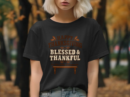 Black t-shirt with "Happy Thanksgiving Blessed & Thankful" text and wooden table graphic.