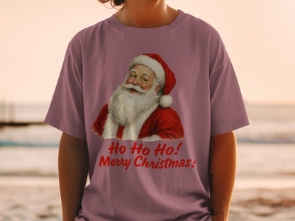 Santa graphic with "Ho Ho Ho! Merry Christmas!" text on a mauve t-shirt.