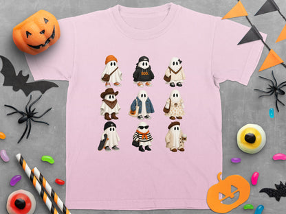 Pink t-shirt with nine cartoon ghosts in Halloween costumes, including "BOO." text.