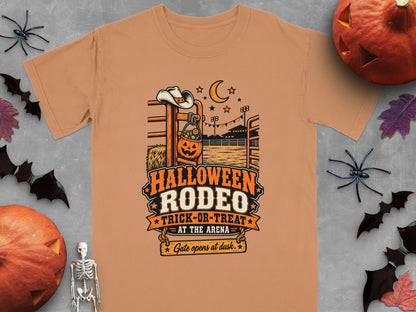 Orange t-shirt with Halloween Rodeo Trick-or-Treat design featuring cowboy hat and pumpkin.