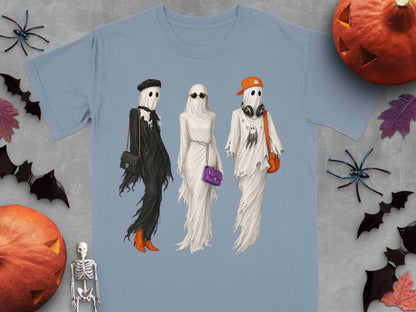Three ghosts in stylish Halloween outfits, one in black, one in white, one with ghost print.