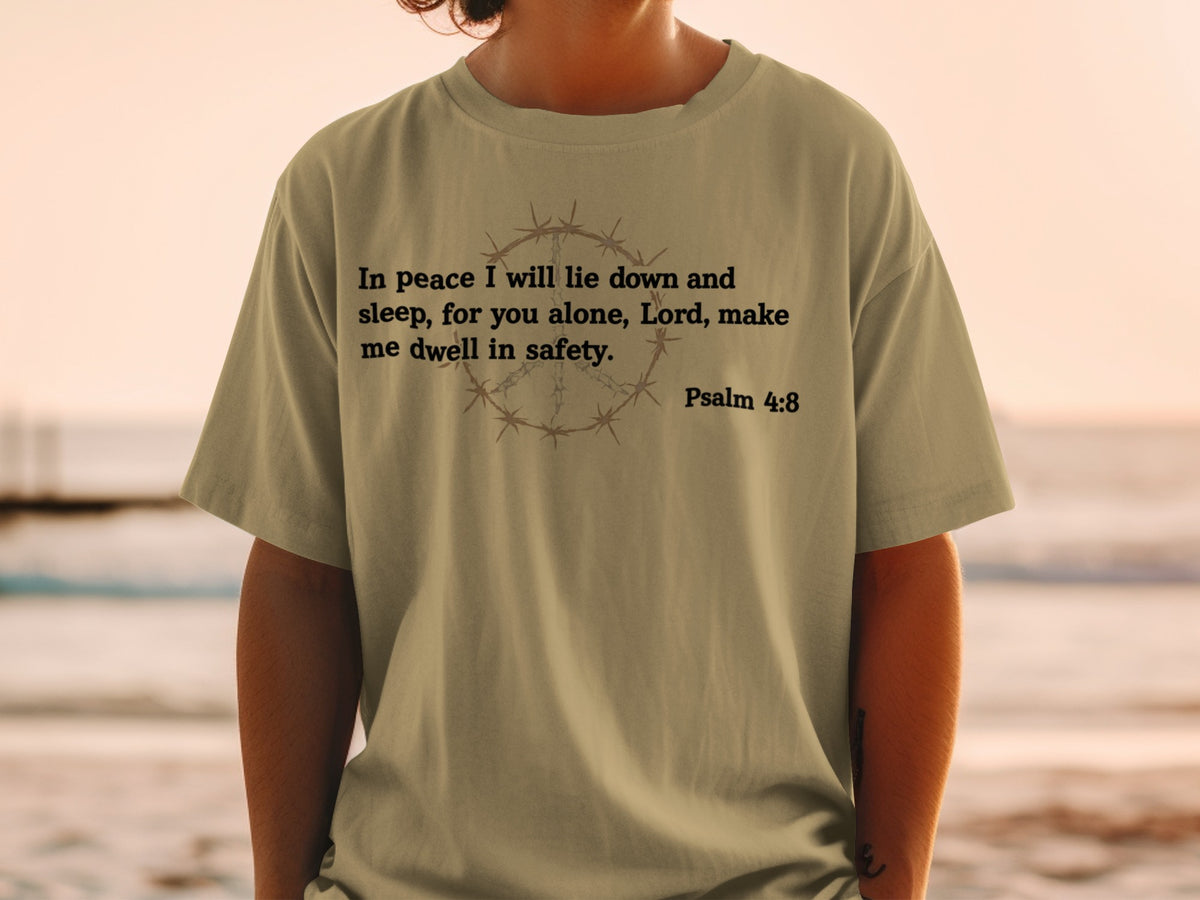 Olive t-shirt with barbed wire peace sign and Psalm 4:8 quote.