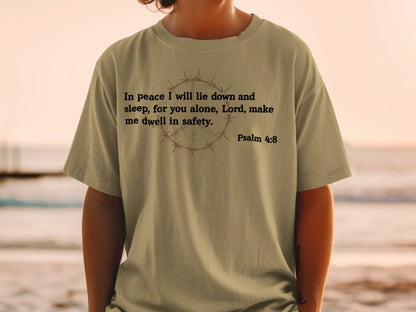 Olive t-shirt with barbed wire peace sign and Psalm 4:8 quote.