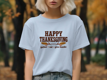 Light blue t-shirt with "Happy Thanksgiving" and "gather eat give thanks" text.