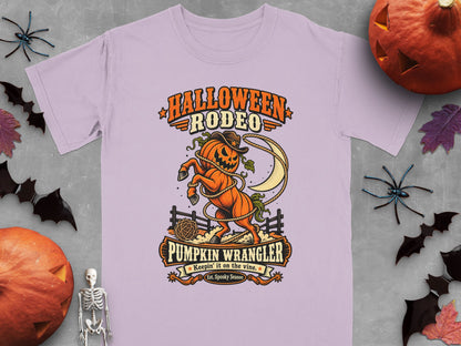 Halloween Rodeo graphic with a pumpkin horse, moon, and rope. Pumpkin Wrangler text.