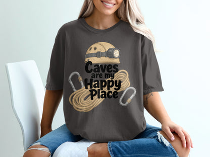 T-shirt with a caving helmet, rope, carabiners, and text reading "Caves are my Happy Place."