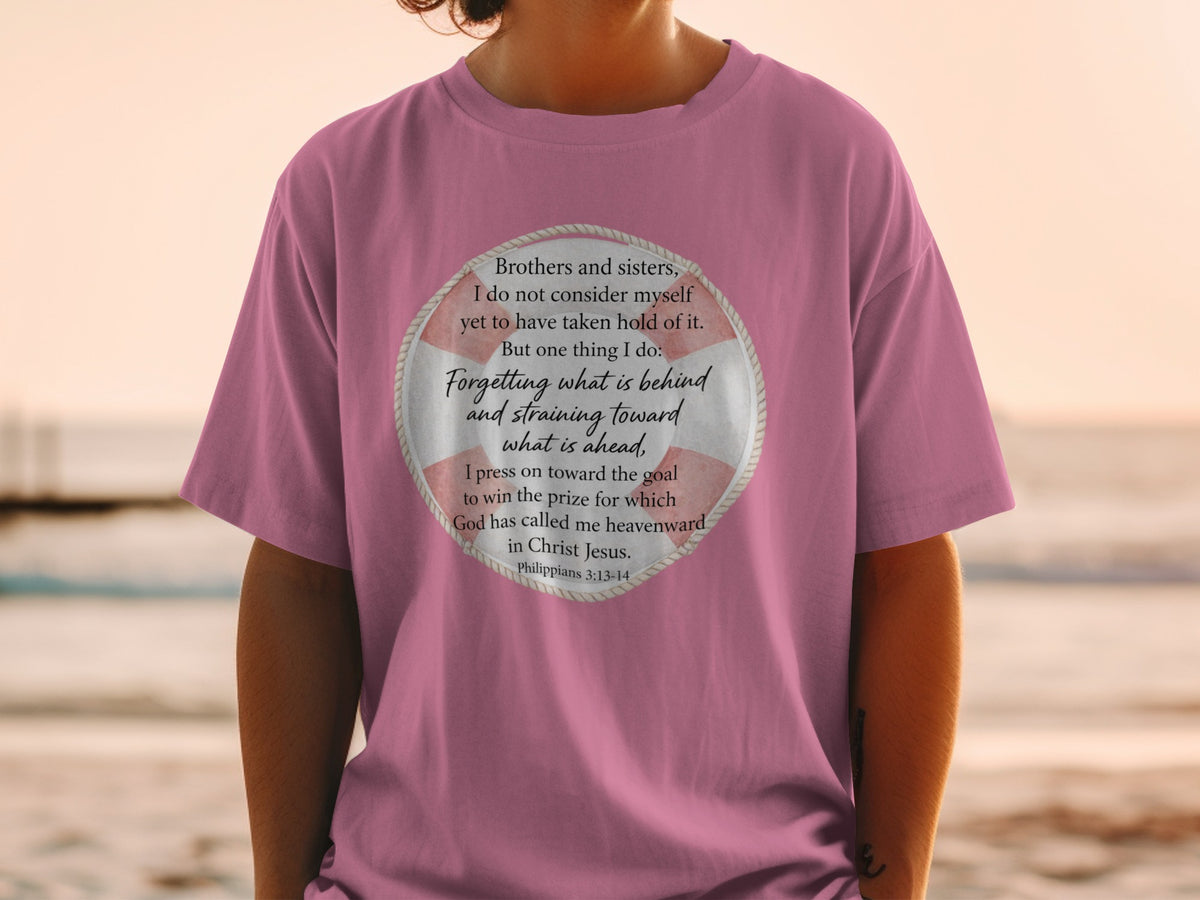 Pink t-shirt with biblical quote "Forgetting what is behind... in Christ Jesus."