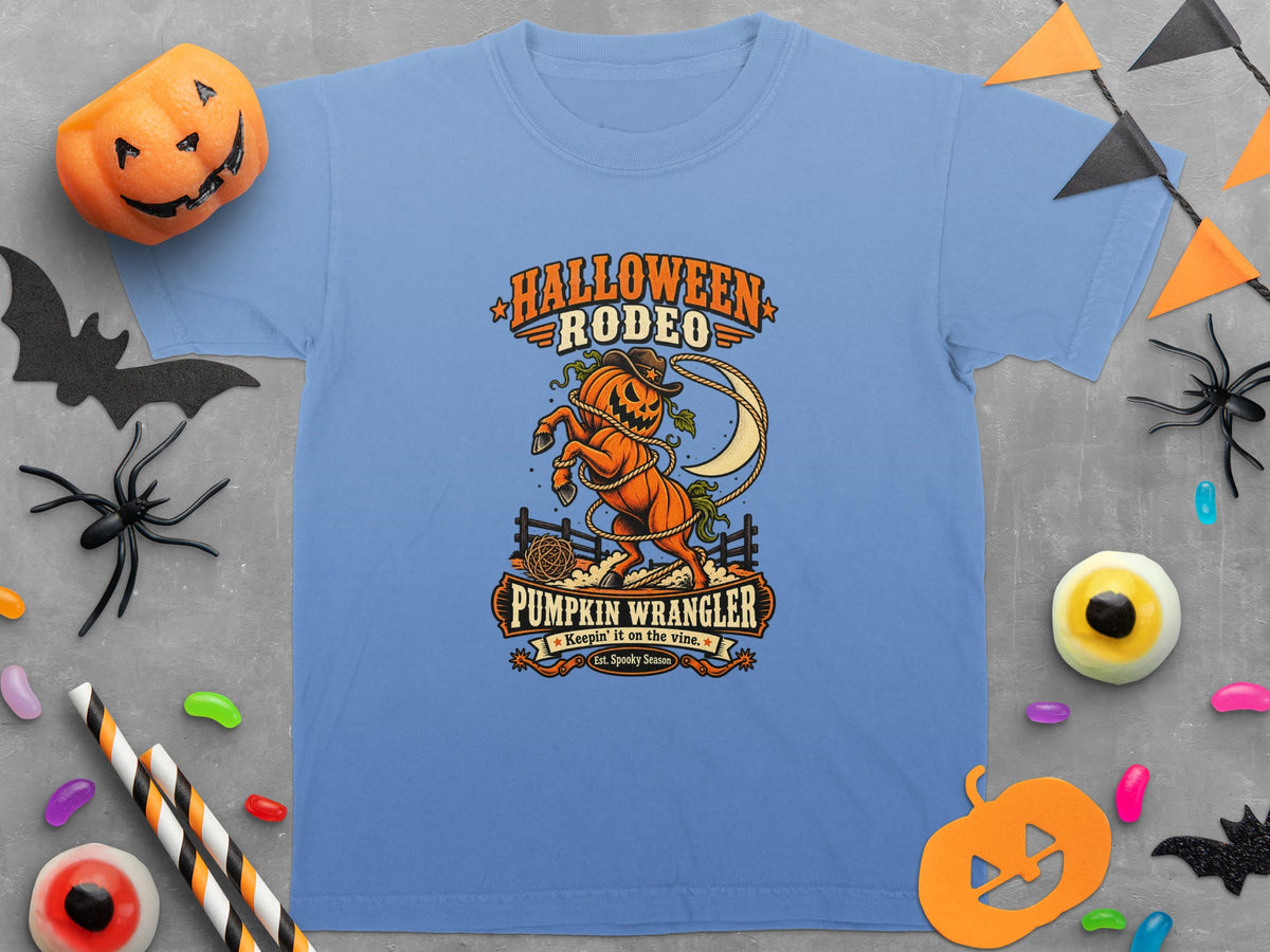 Light blue t-shirt with "Halloween Rodeo Pumpkin Wrangler" graphic and Halloween decorations.